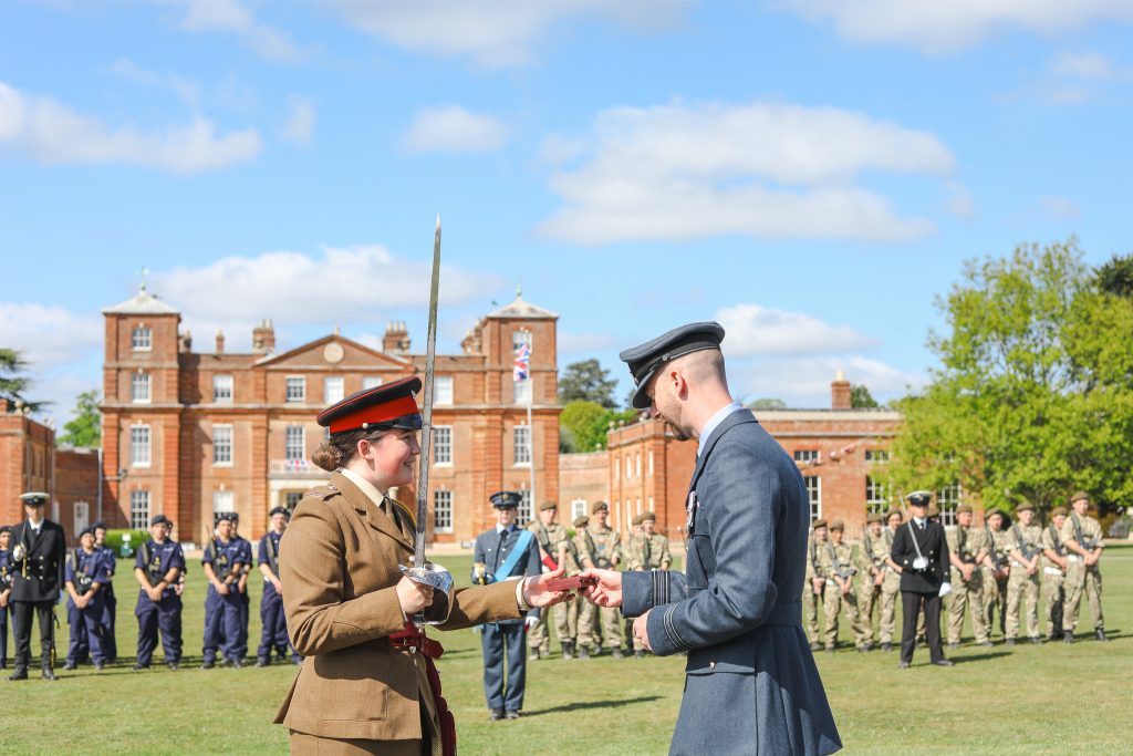 A senior-ranking military officer inspecting the school's Combined Cadet Force during the VE Day celebration at Langley Senior School.